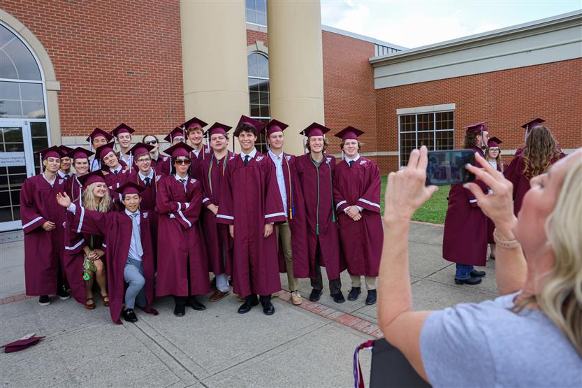 Graduates wearing maroon robes